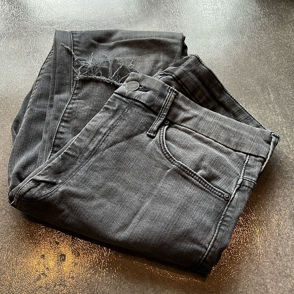 Barely worn Mother skinny jean with raw edge bottom edges in dark gray